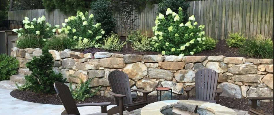 A fire pit surrounded by chairs.