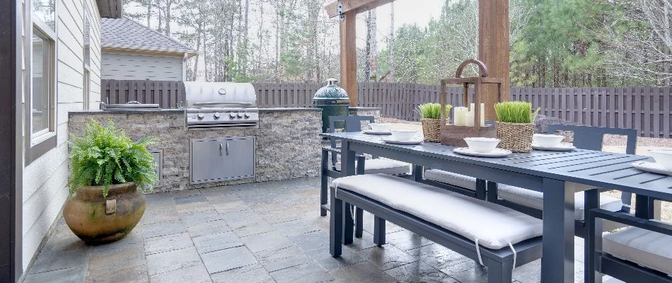 Outdoor kitchen and table on a patio in Landis, NC.