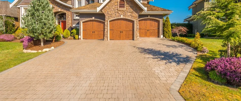 Paver driveway in front of a house's garage in Charlotte, NC.