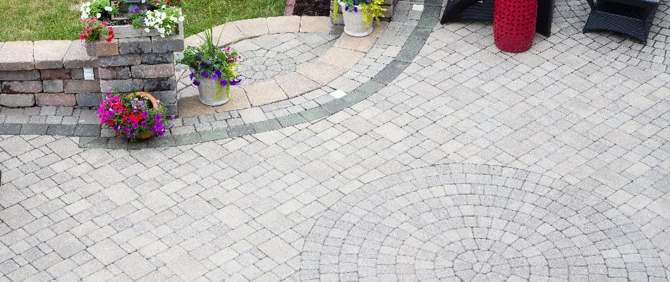 Paver patio in Lake Wylie, SC, and flowers in pots.
