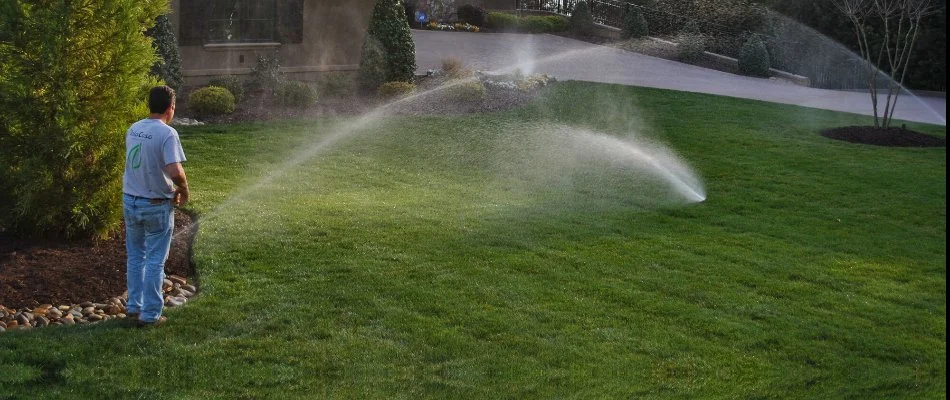 Worker in Mooresville, NC, setting up an irrigation system.