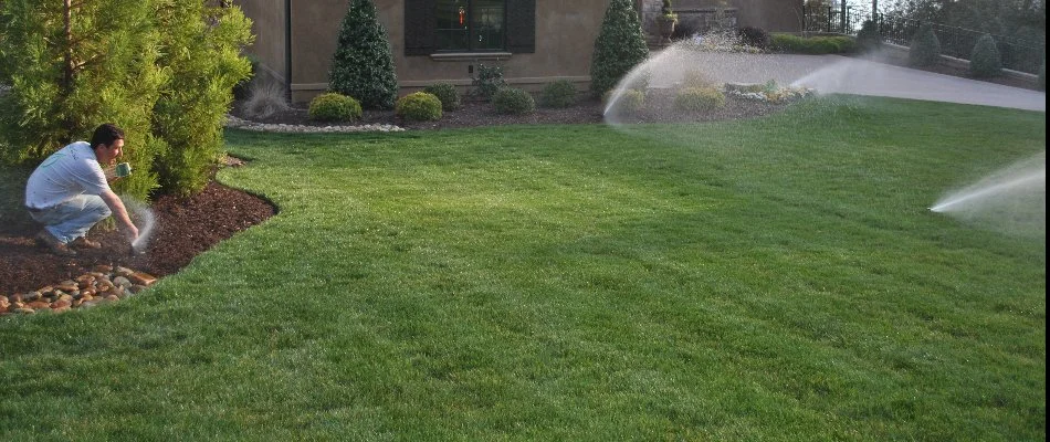 Worker in Lake Norman, NC, starting up an irrigation system.