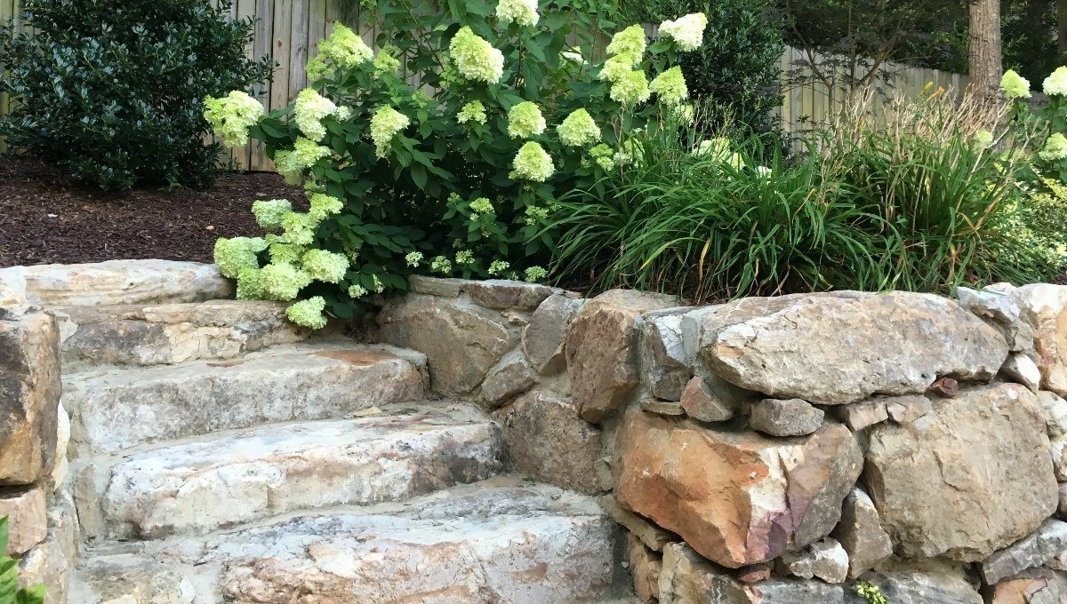 Home in Lake Norman, NC with siloam stone steps and a boulder wall.
